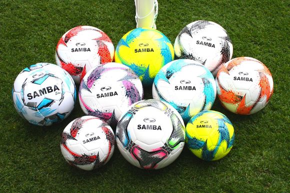 A bunch of soccer balls with samba written on them