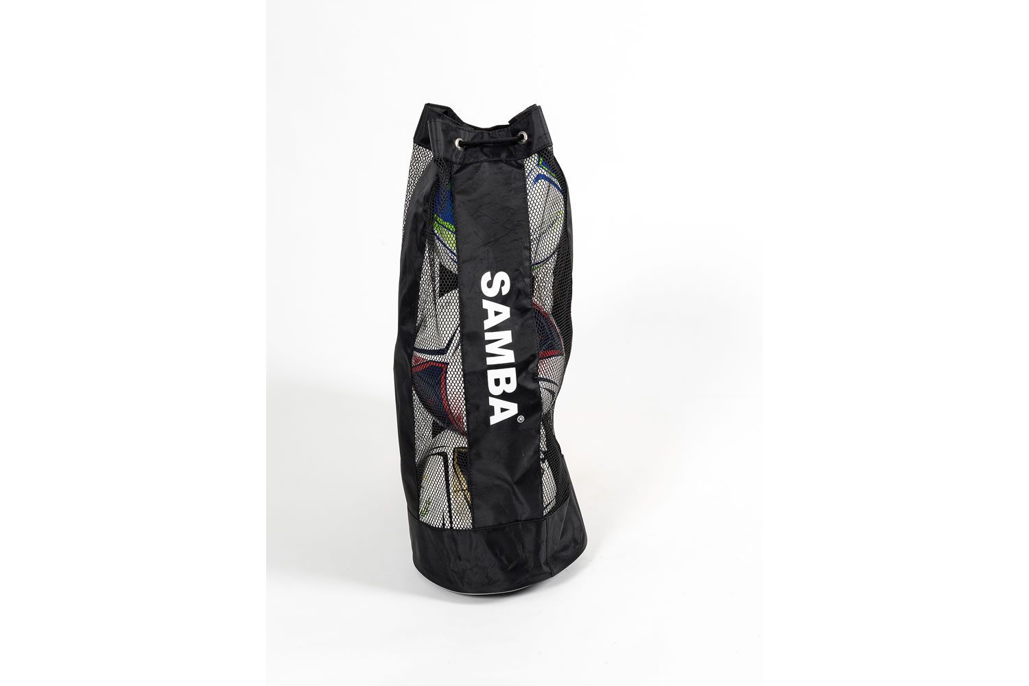 A black samba bag is sitting on a white surface