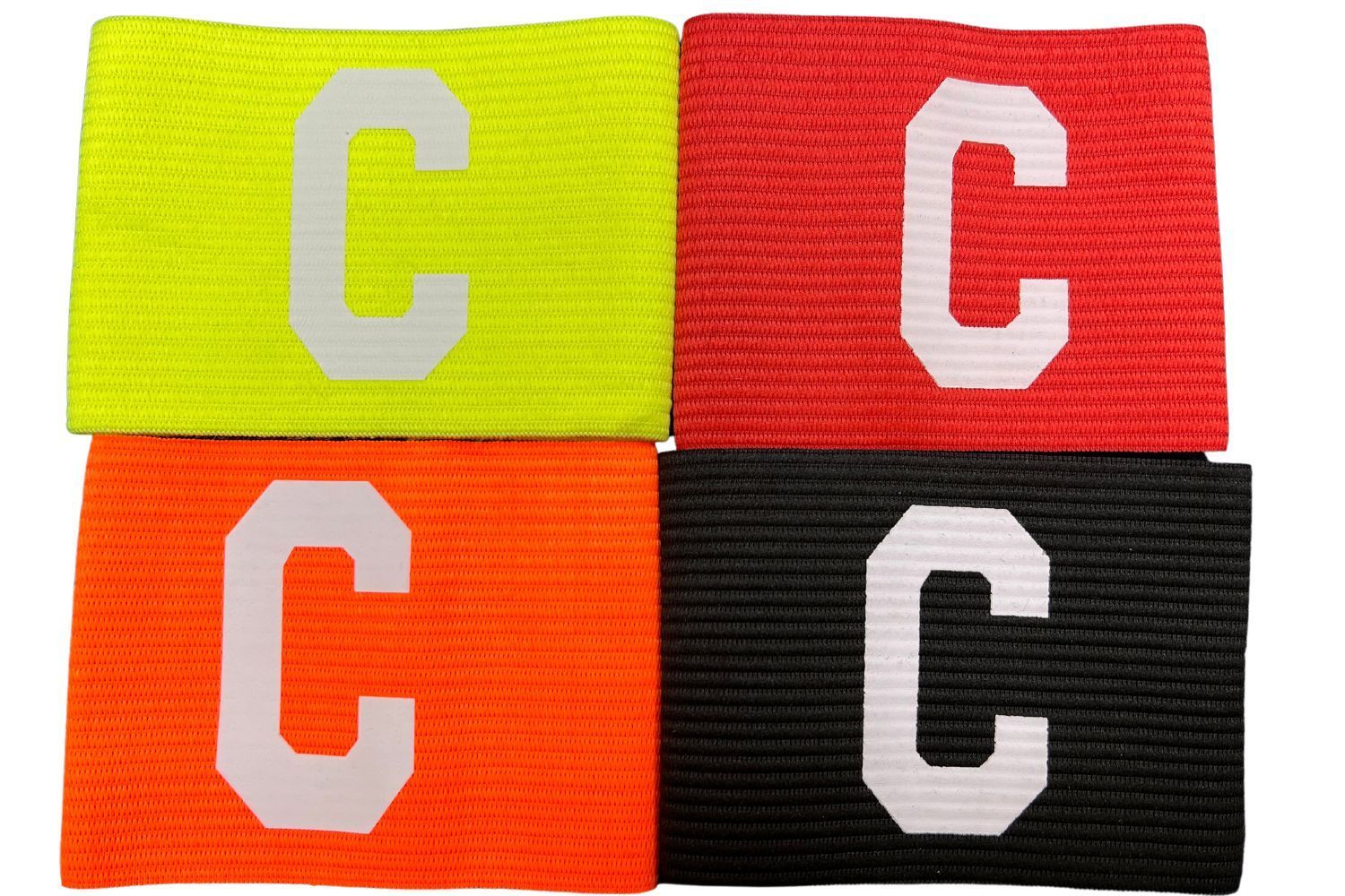 Four different colored wristbands with the letter c on them