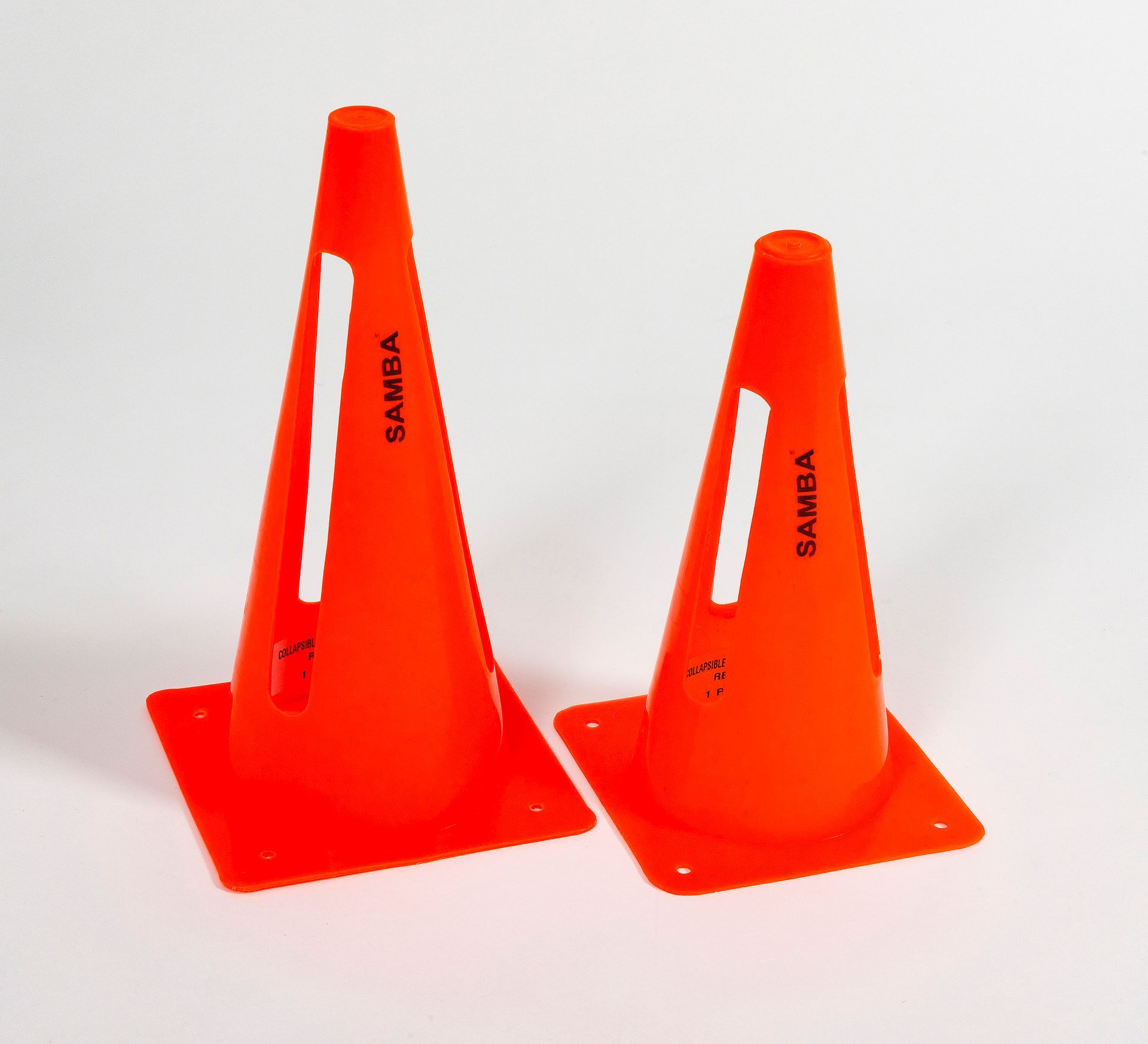 Two orange cones with the word sahara on them