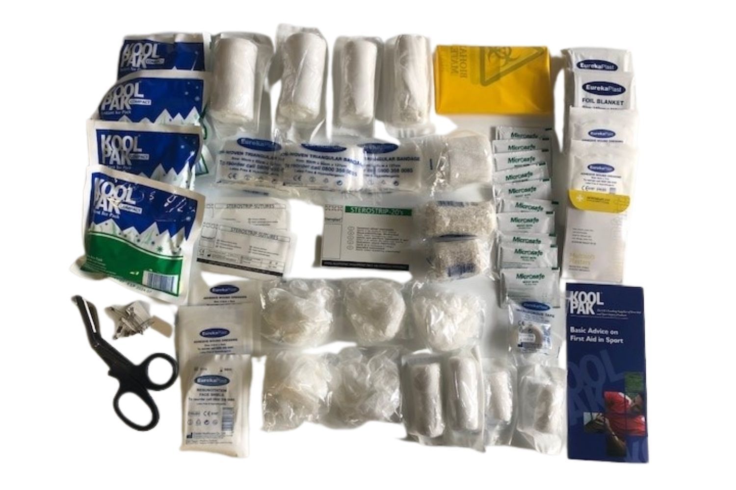 A first aid kit filled with bandages , scissors , and other items.