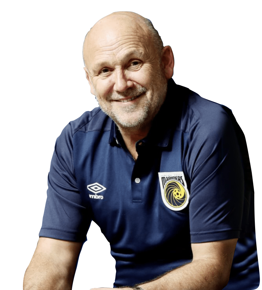 A man wearing a blue umbro polo shirt is smiling