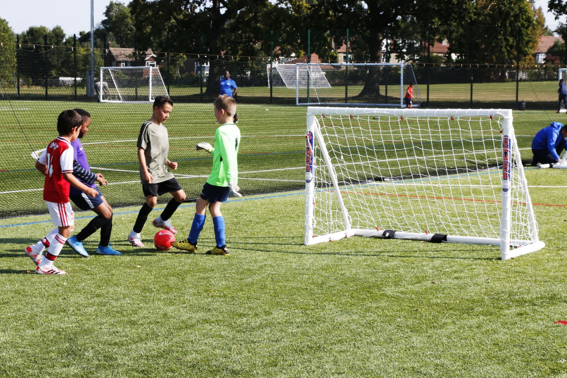 A group of young boys are playing soccer on a field