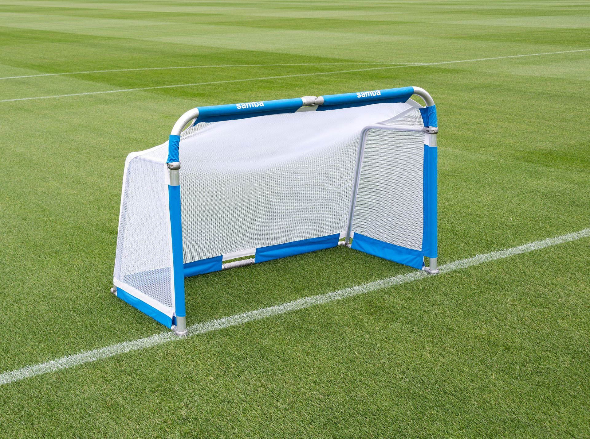 A blue and white soccer goal on a field