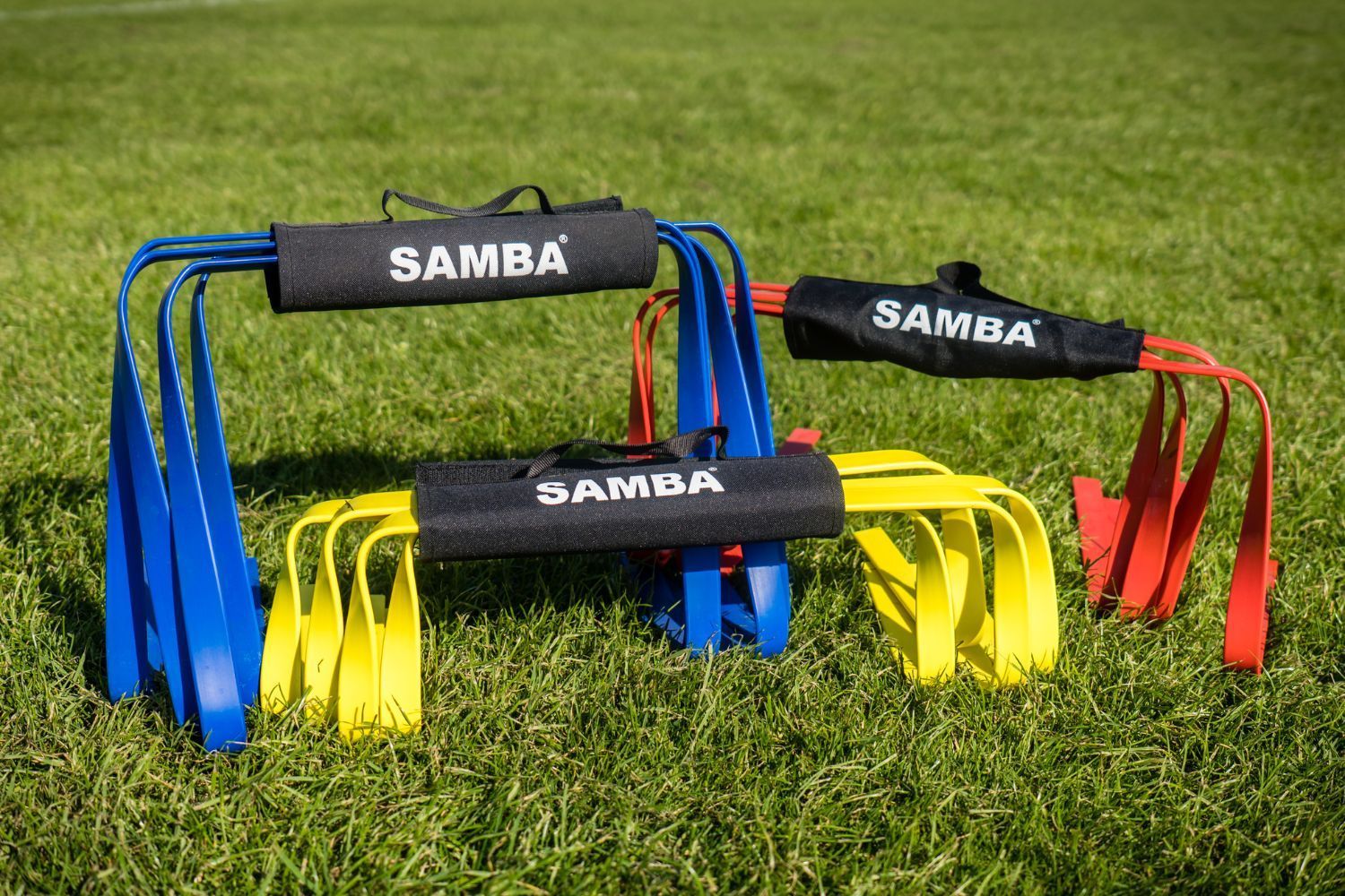 Three samba hurdles are sitting in the grass