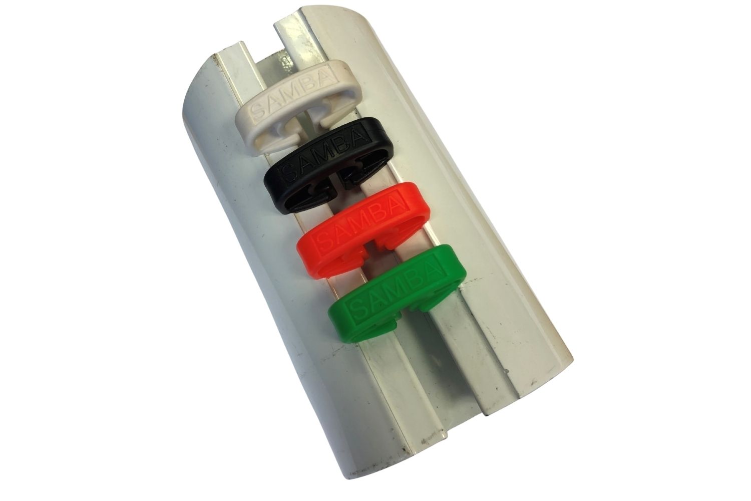 A close up of a ring holder with three different colored rings on it
