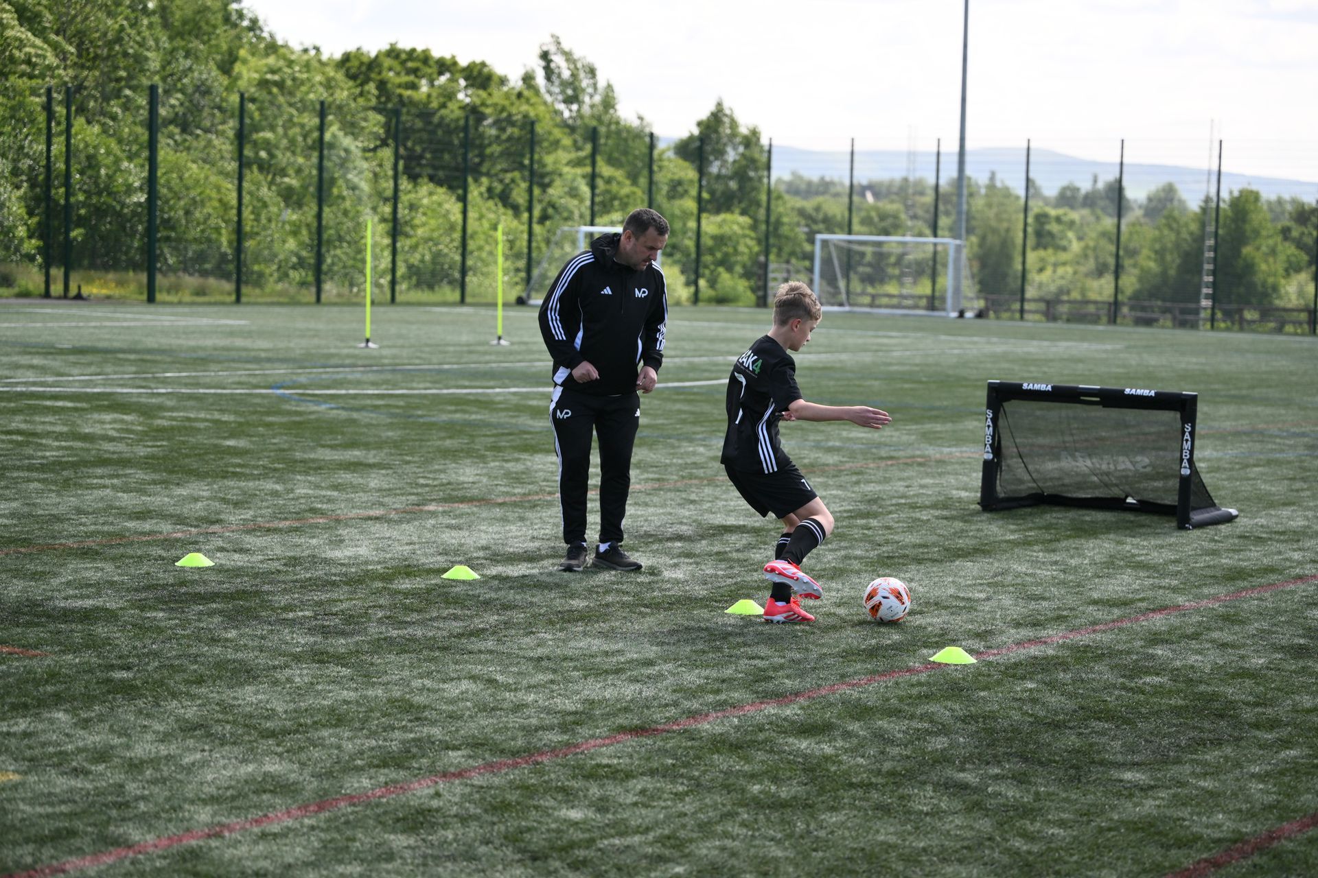 A bunch of soccer balls with samba written on them