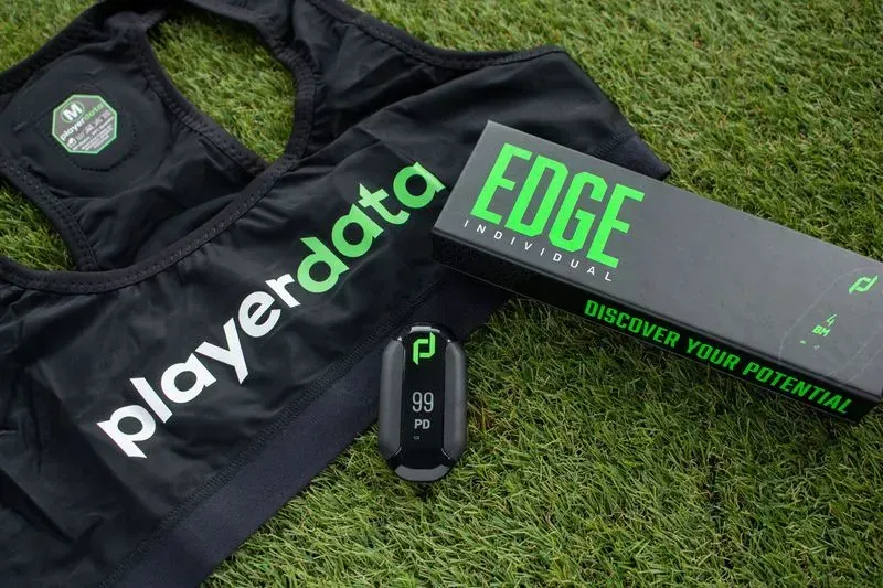 A playerdata edge device is sitting on the grass