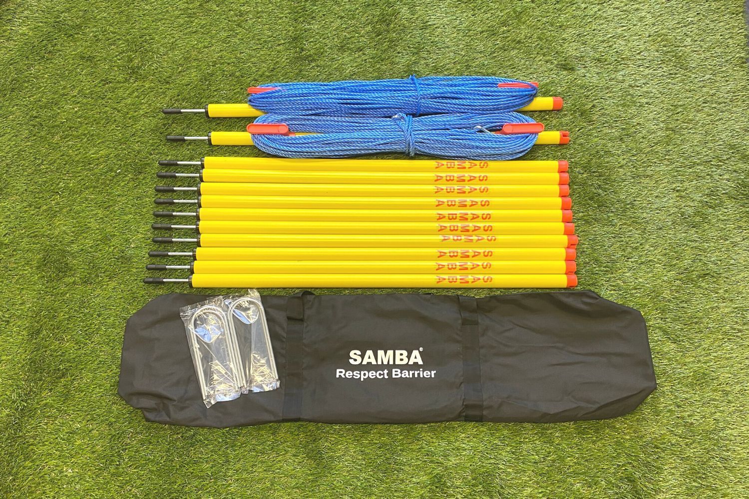 A bunch of yellow poles and a bag that says ' bamba ' on it