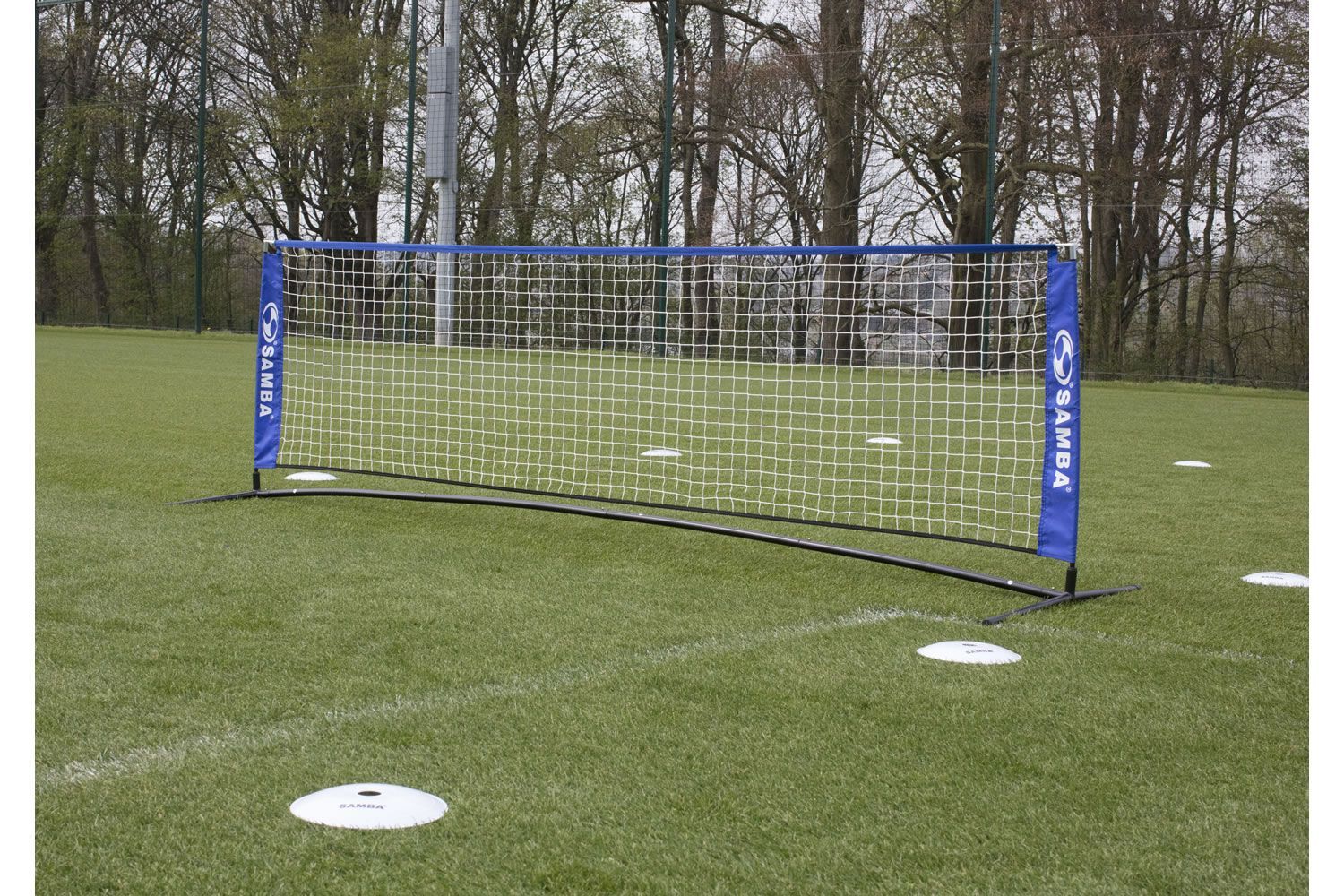 A soccer goal with a blue banner that says ' soccer ' on it