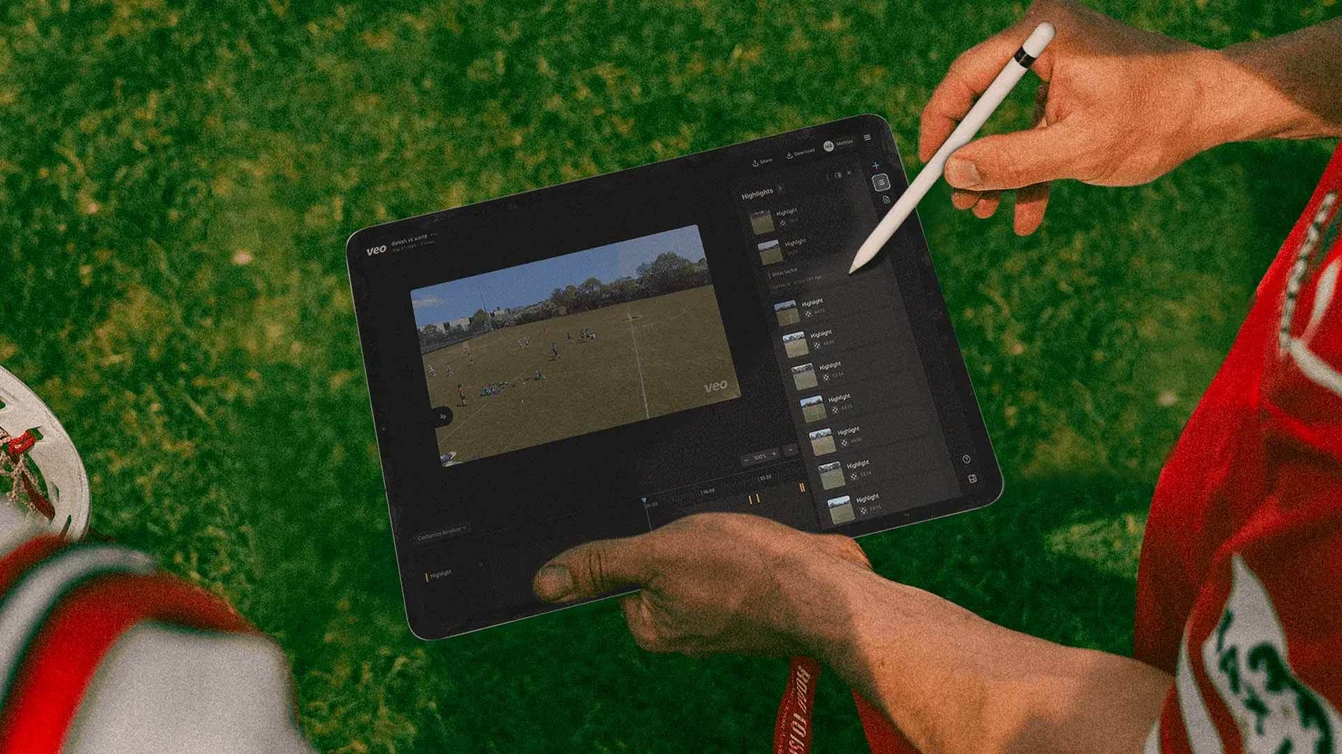 A person holding a tablet with a pen in their hand