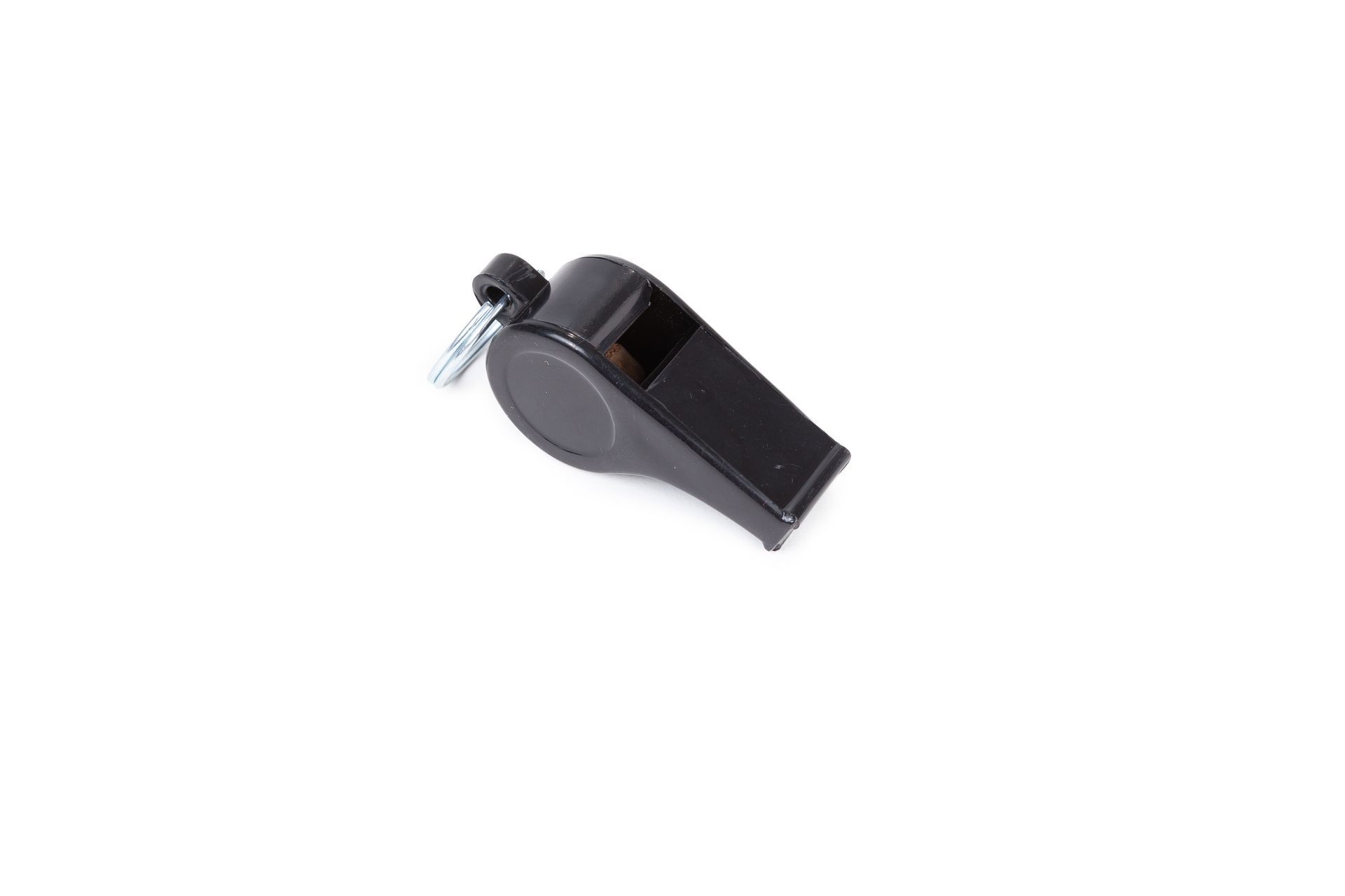 A black whistle is sitting on a white surface.
