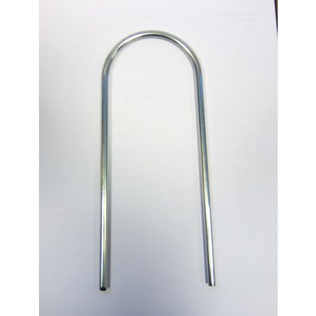 A metal pipe is sitting on a white surface.