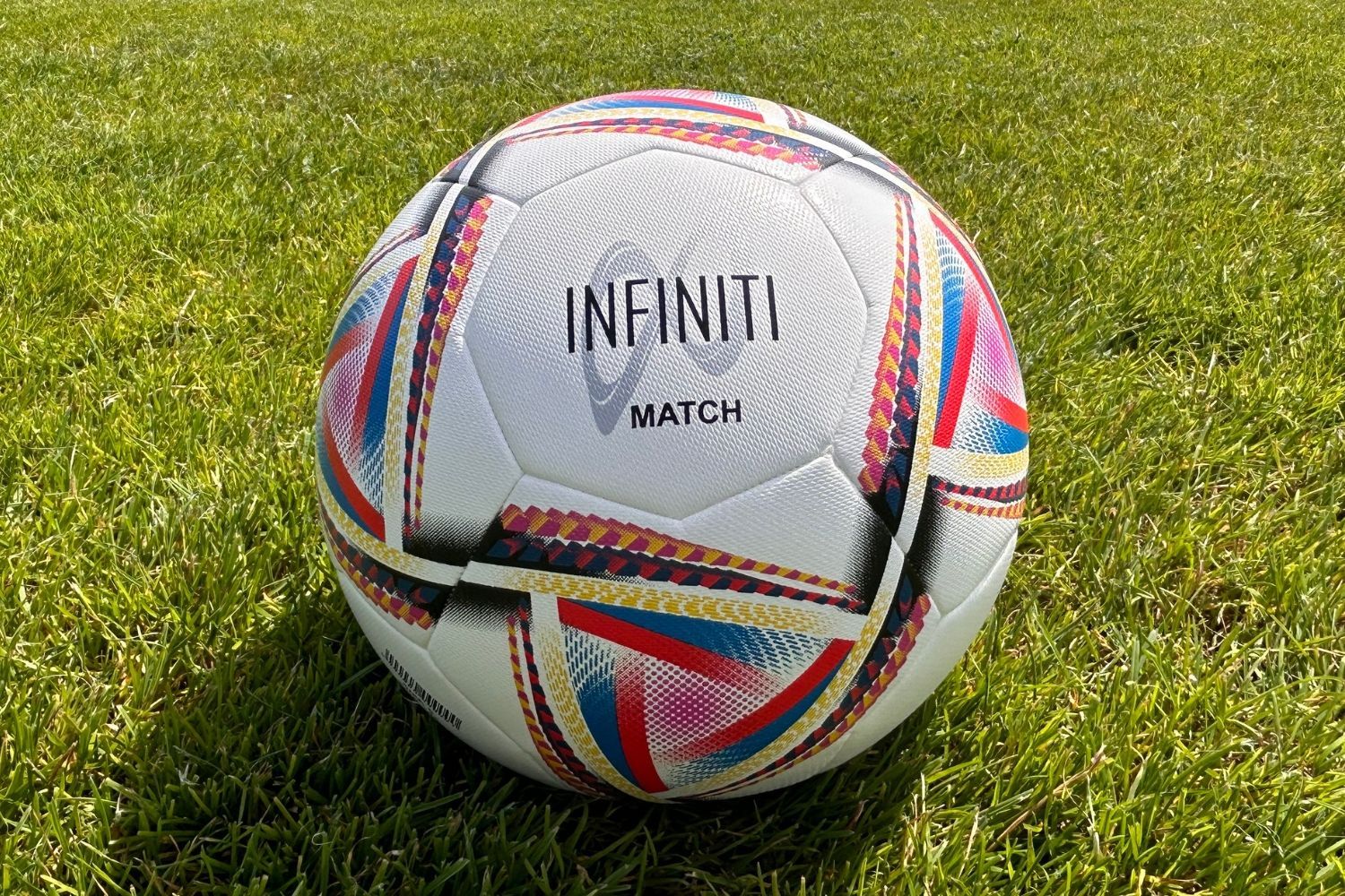 A soccer ball with the word infinity on it