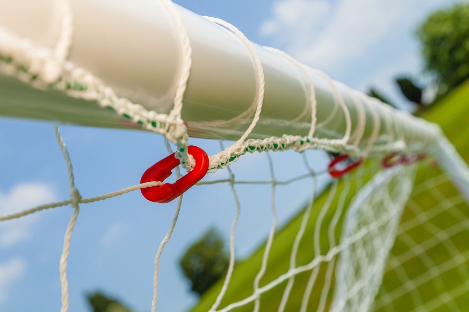 A close up of a soccer net with a red ring on it