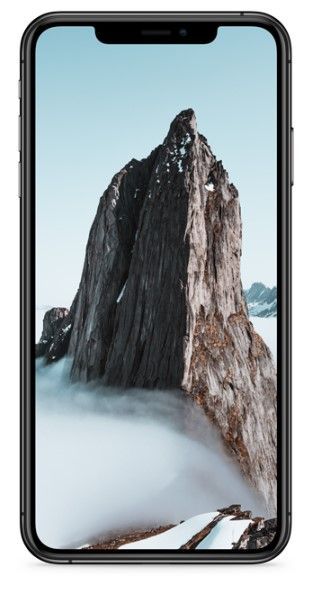 Teléfono inteligente que muestra un pico montañoso escarpado y cubierto de nieve que se eleva por encima.