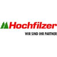 Hochfilzer logo in red and green with the slogan “Wir sind Ihr Partner” on a white background