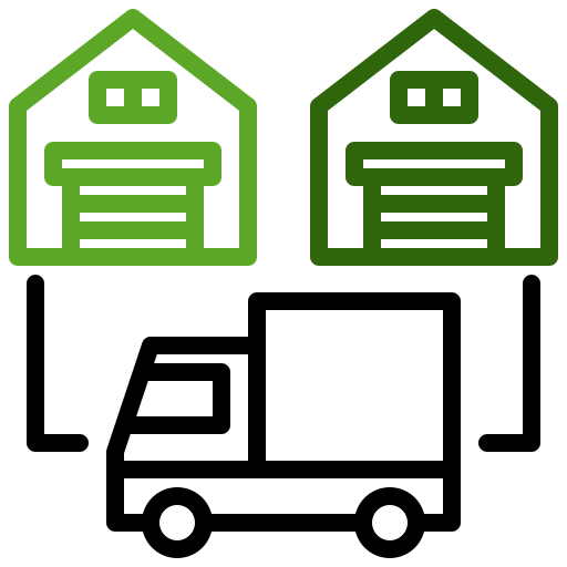 Almacenes verdes con muelles de carga conectados a un camión de reparto.