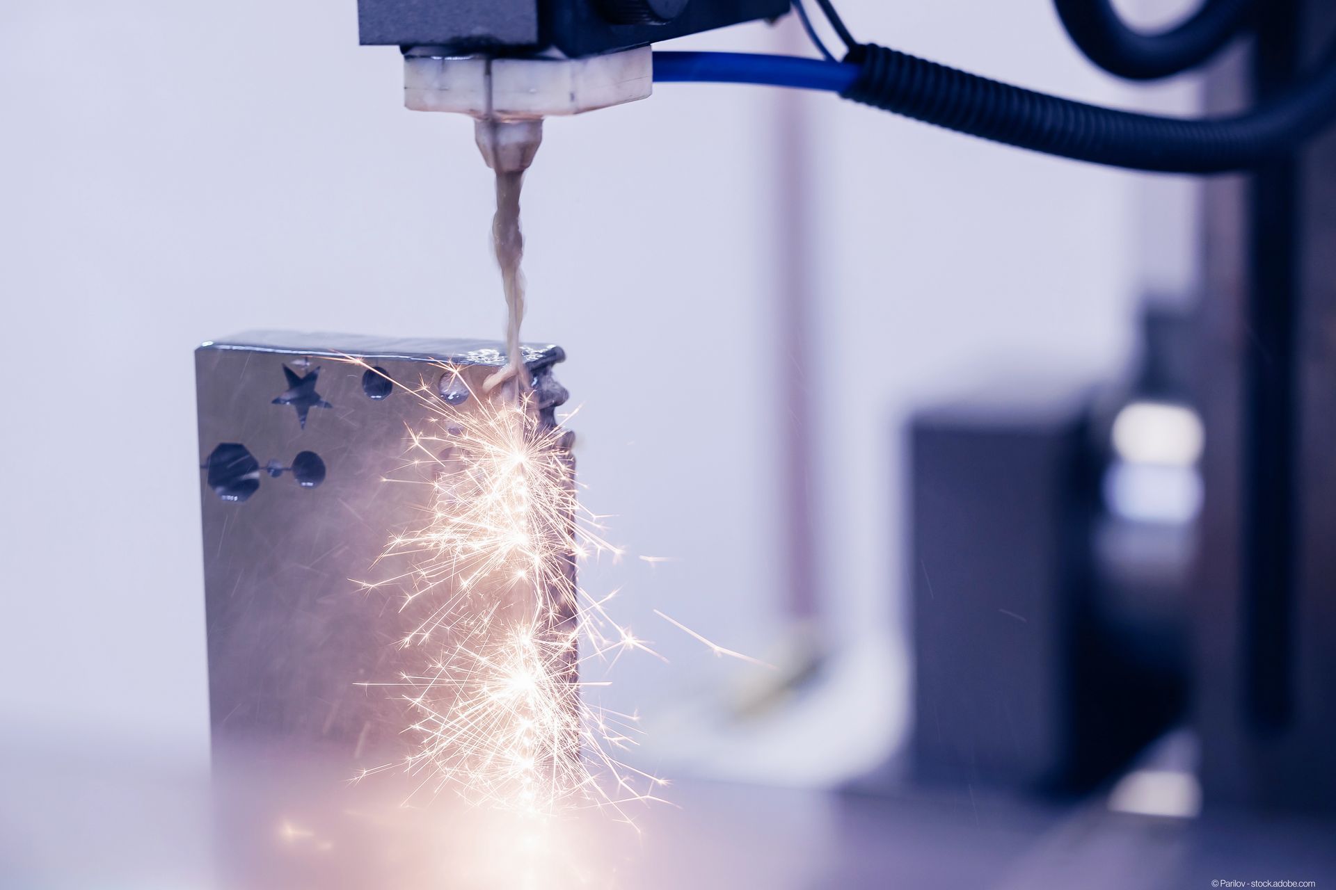 Wire cutting machine cuts a piece of metal