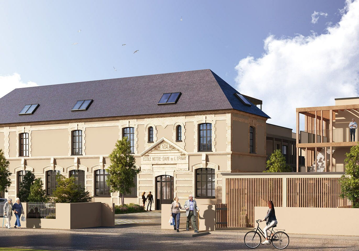 Bâtiment beige au toit sombre, jouxtant une structure moderne en bois.