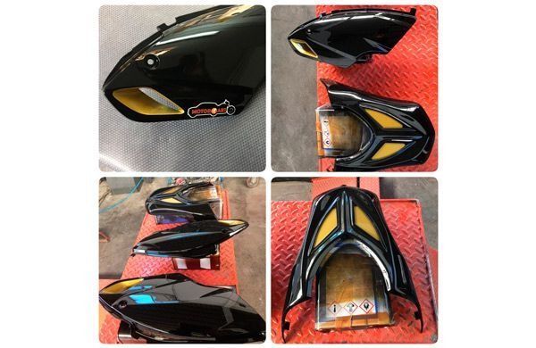 Un collage de cuatro imágenes de una motocicleta negra y amarilla.