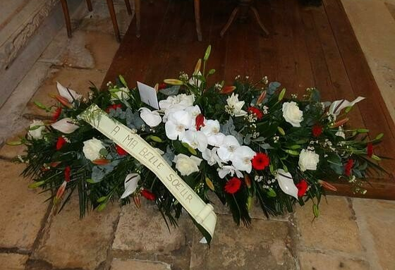 Raquette de fleurs pour un deuil