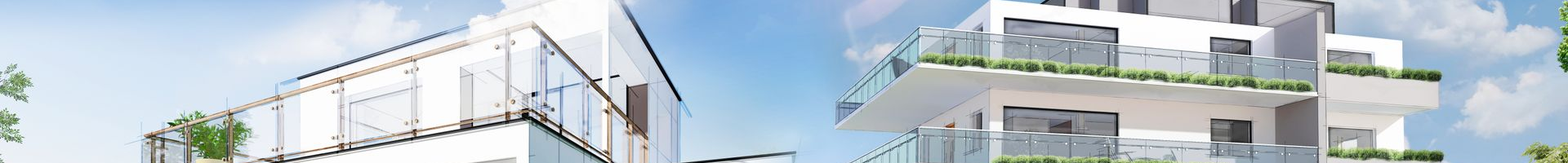 Immeubles d'appartements blancs modernes avec balcons en verre contre un ciel bleu.