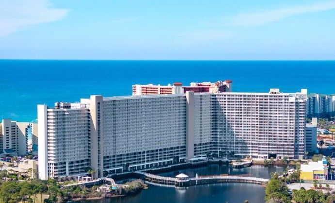 Laketown Wharf resort aerial pool view with palm trees, Panama City Beach, FL