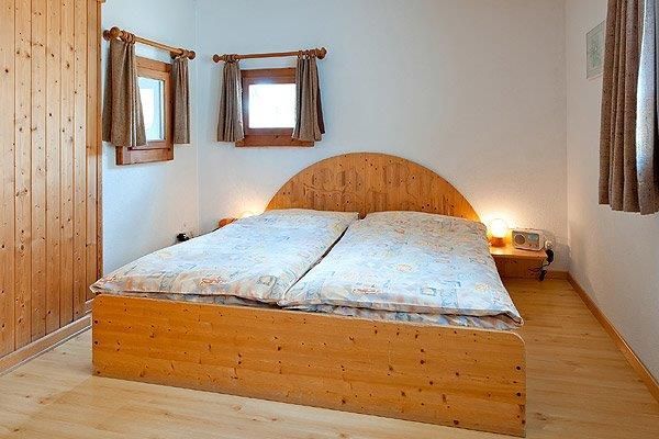 Junior Suite Schlafzimmer Marmotta - Hotel Chesa Grischa in Sils-Baselgia