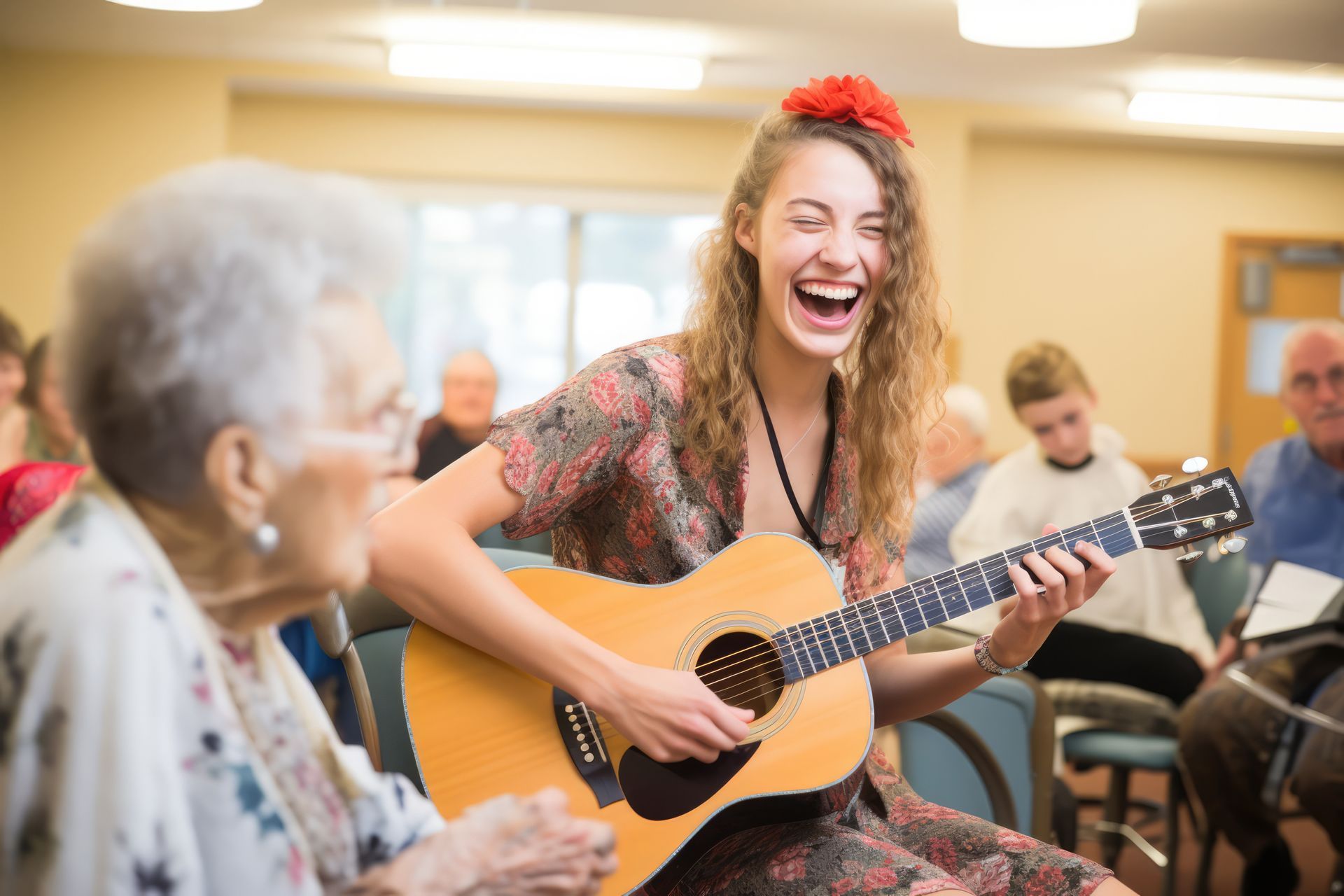 Artiste qui fait de la guitare entourée de personnes âgés