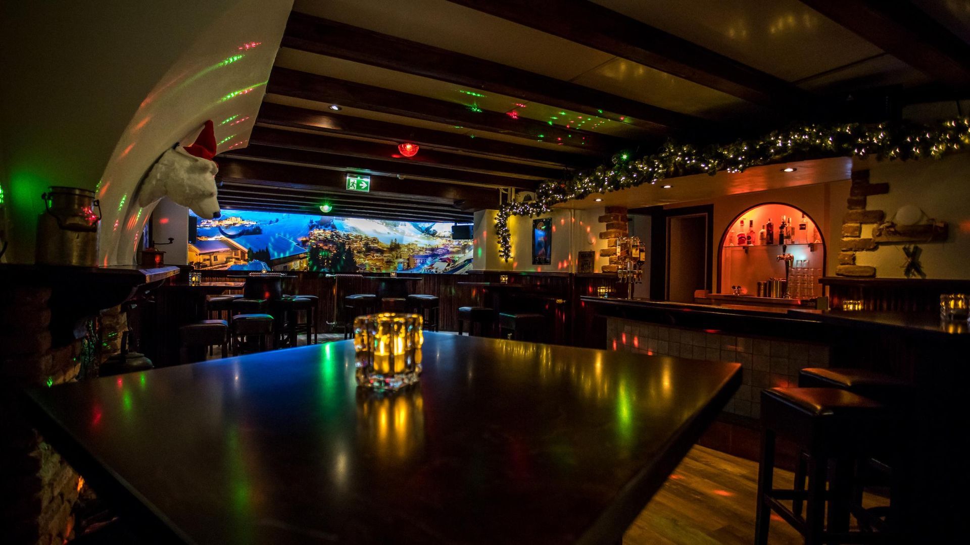 There is a candle on the table in the middle of the room.