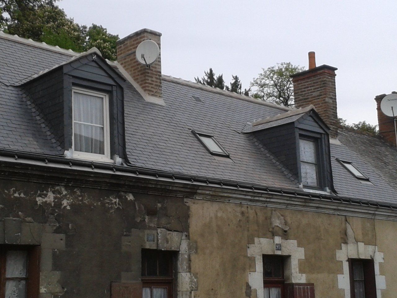 Rénovation de toiture avec deux lucarnes de toit