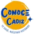 Logo circular amarillo y azul con el texto &ldquo;Conoce C&aacute;diz&rdquo; y el lema &ldquo;Tu viaje, nuestras historias&rdquo;.