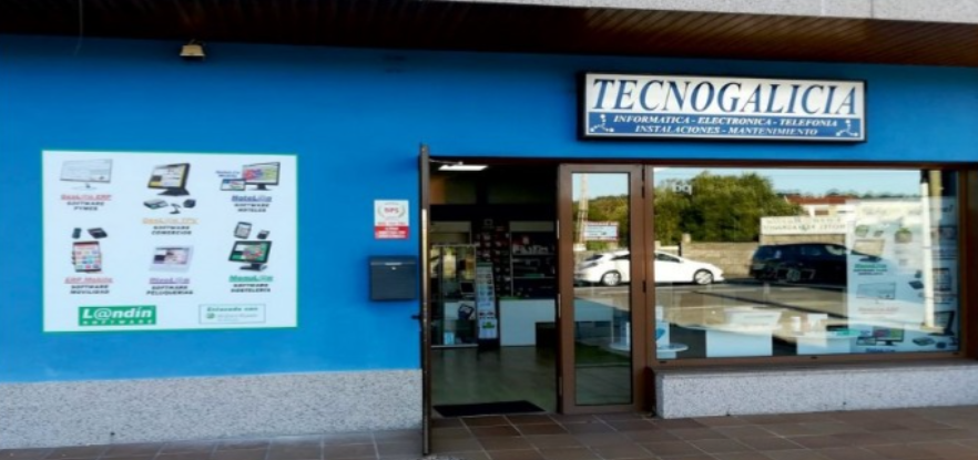 Un edificio azul con un cartel que dice tecnogalicia