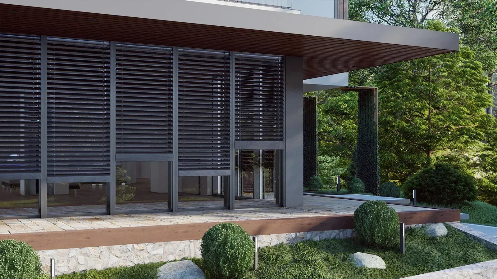 Modernes Hausäußeres mit dunkelgrauen Lamellenschirmen, grüner Landschaftsgestaltung und Steinsockel.