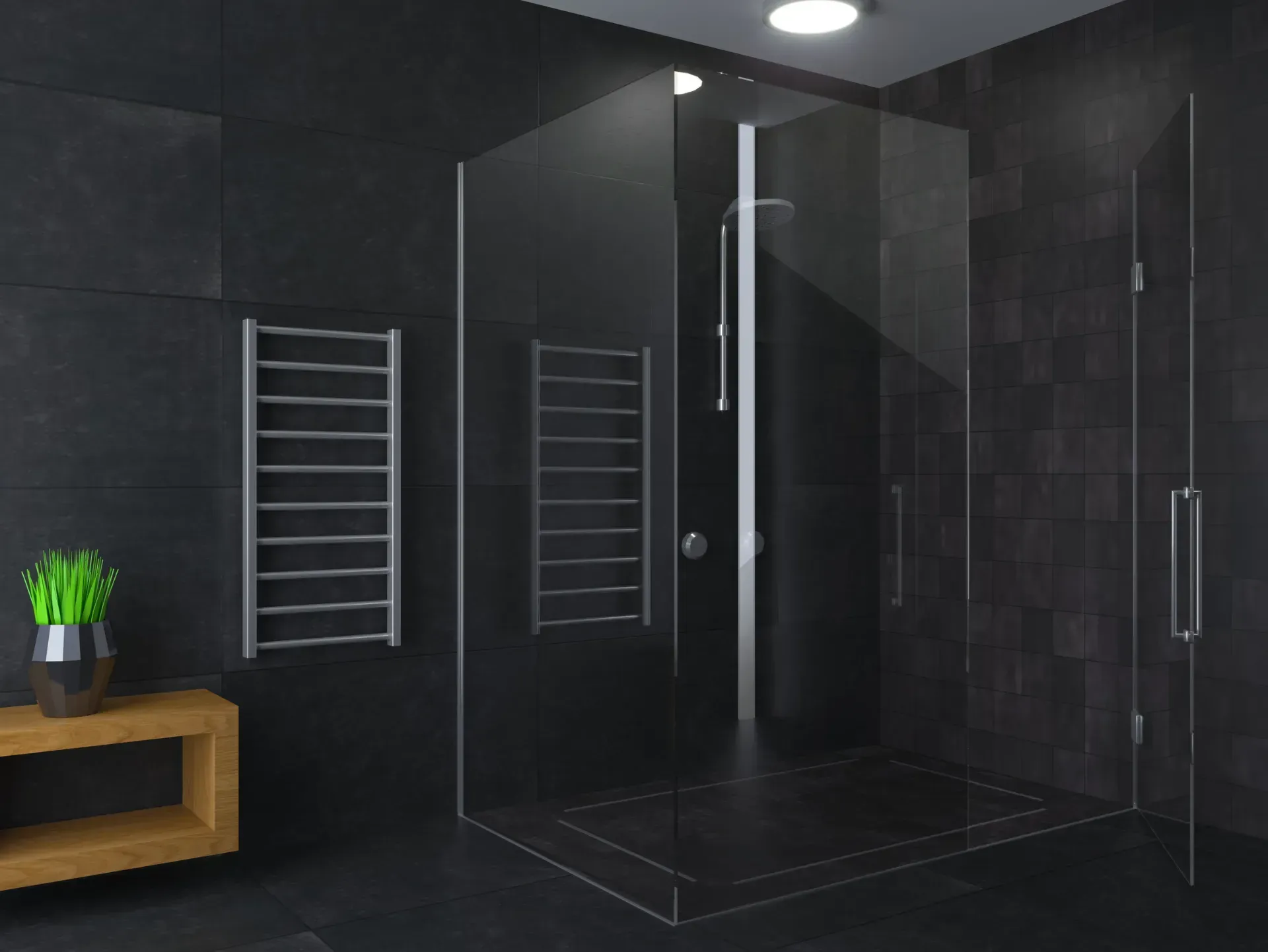 Un baño con azulejos negros y ducha a ras de suelo.