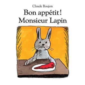 Couverture du livre : lapin gris à une table avec un steak, intitulé Bon appétit ! Monsieur Lapin de Claude Boujon