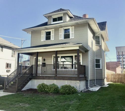 A house with a large porch and stairs