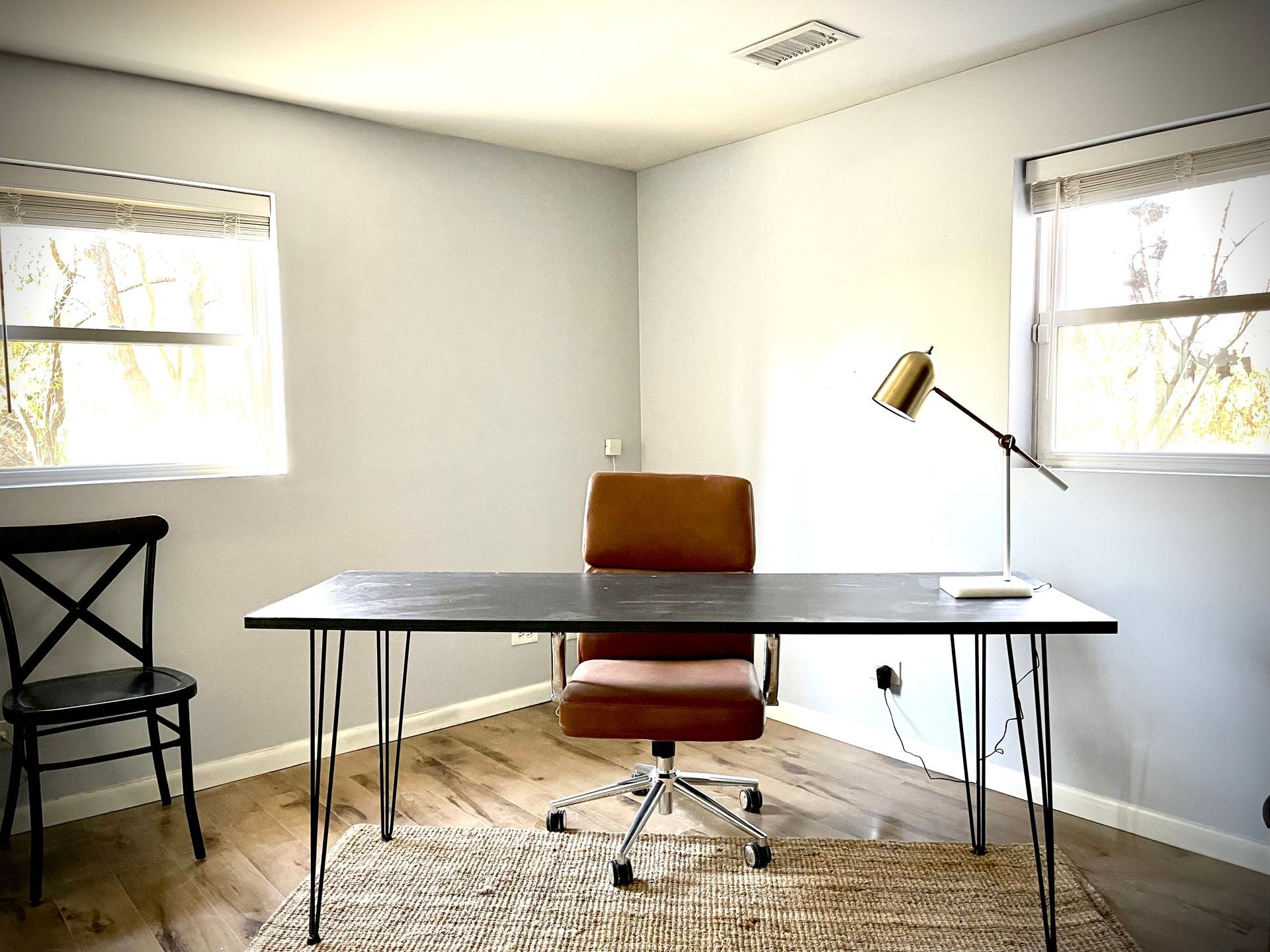 There is a desk and chair in the room.
