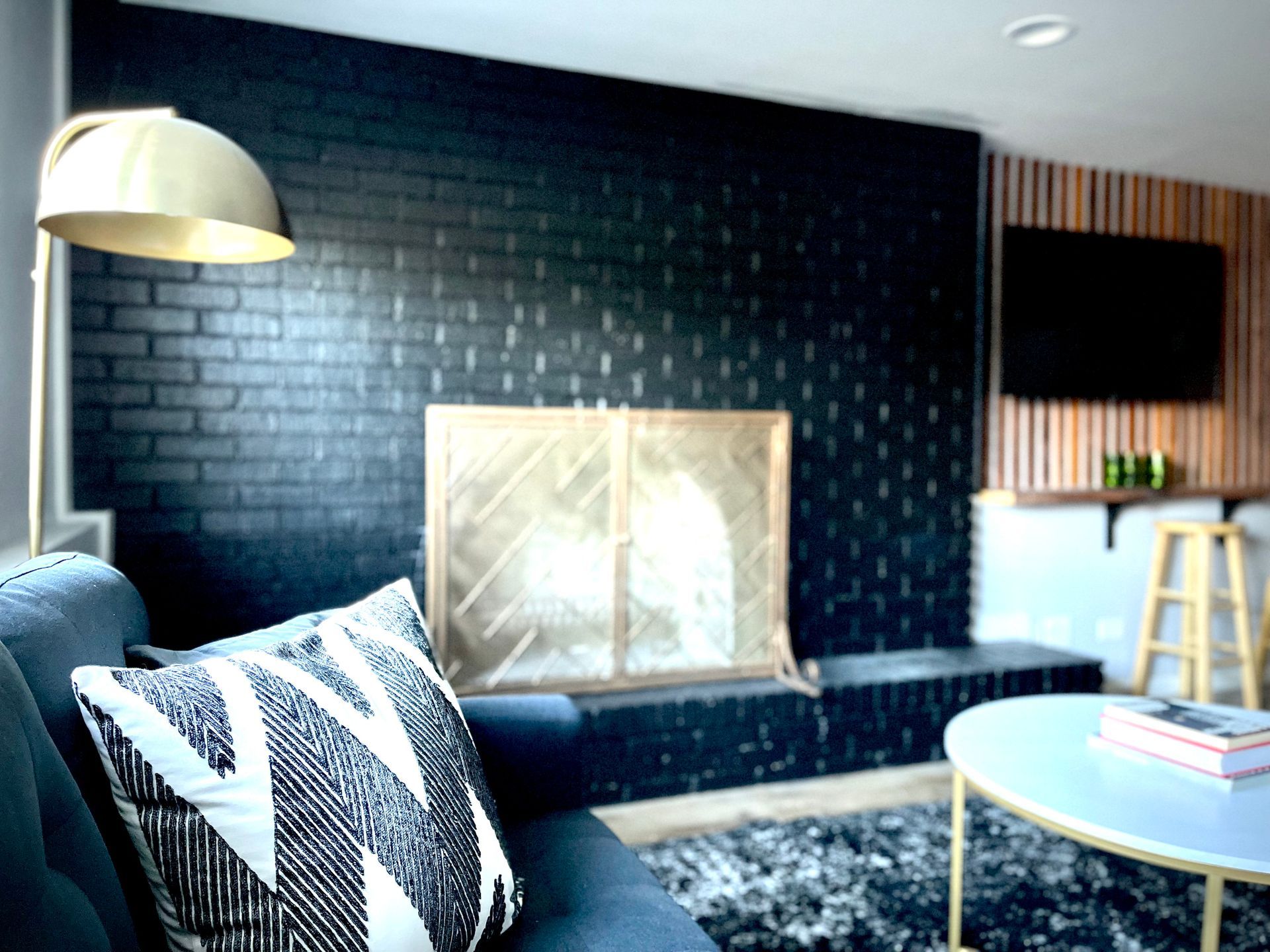 A living room with a fireplace and a couch