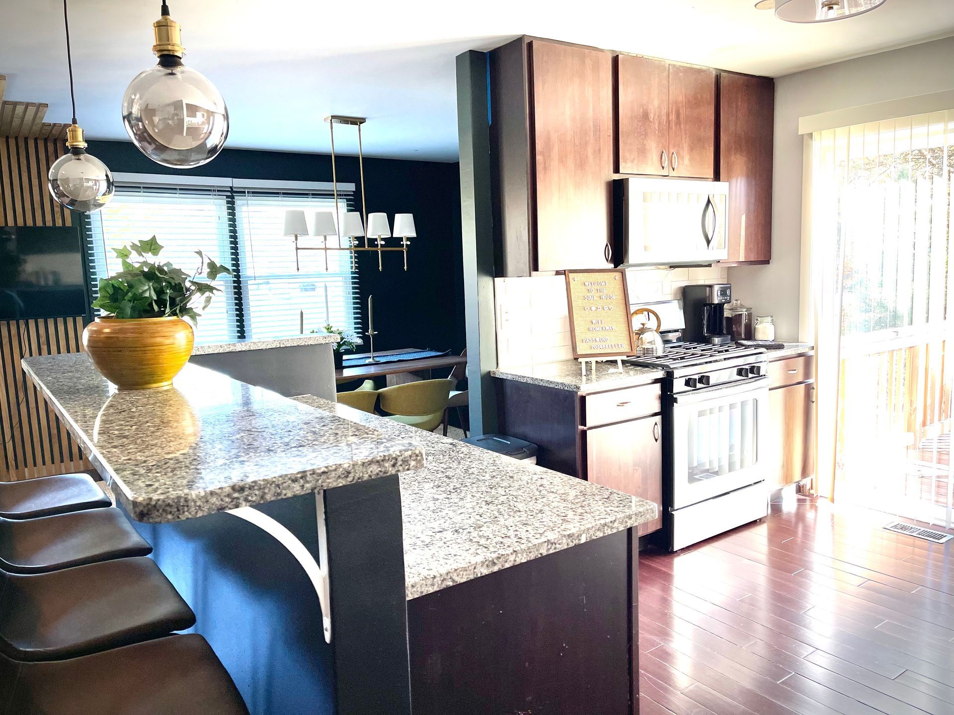 A kitchen with granite counter tops and a stove