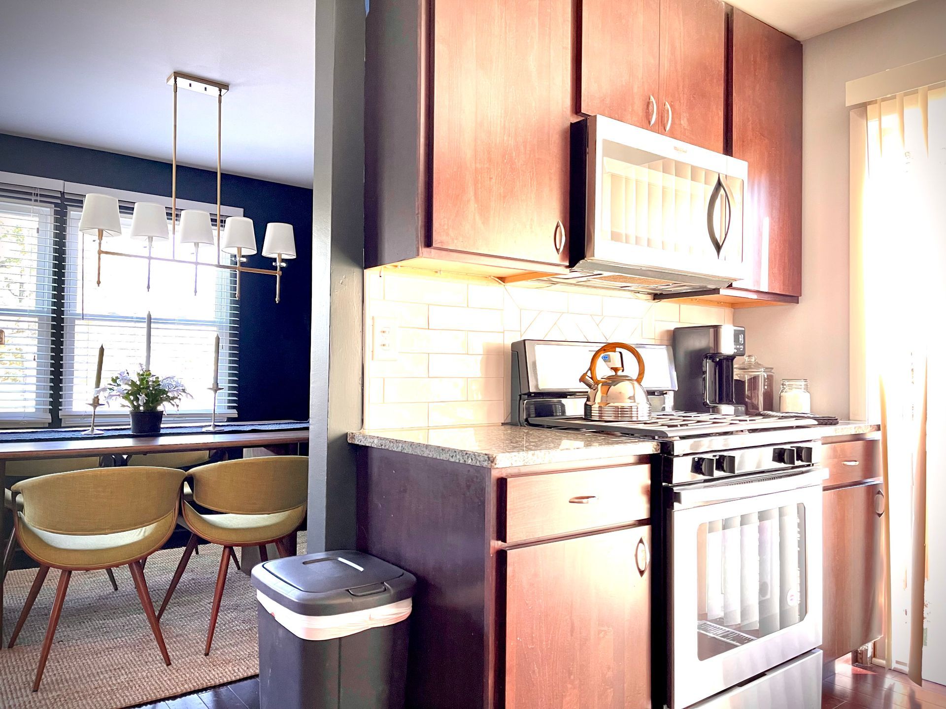 A kitchen with stainless steel appliances and wooden cabinets