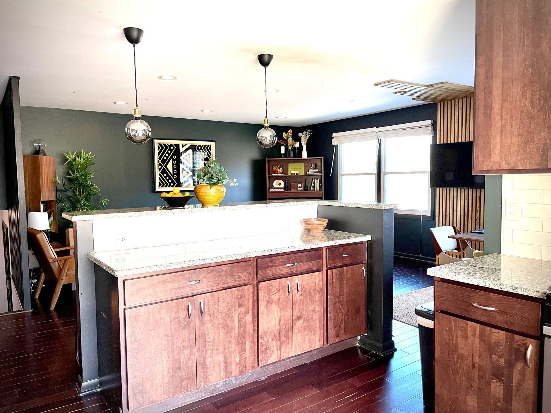 A kitchen with wooden cabinets and granite counter tops