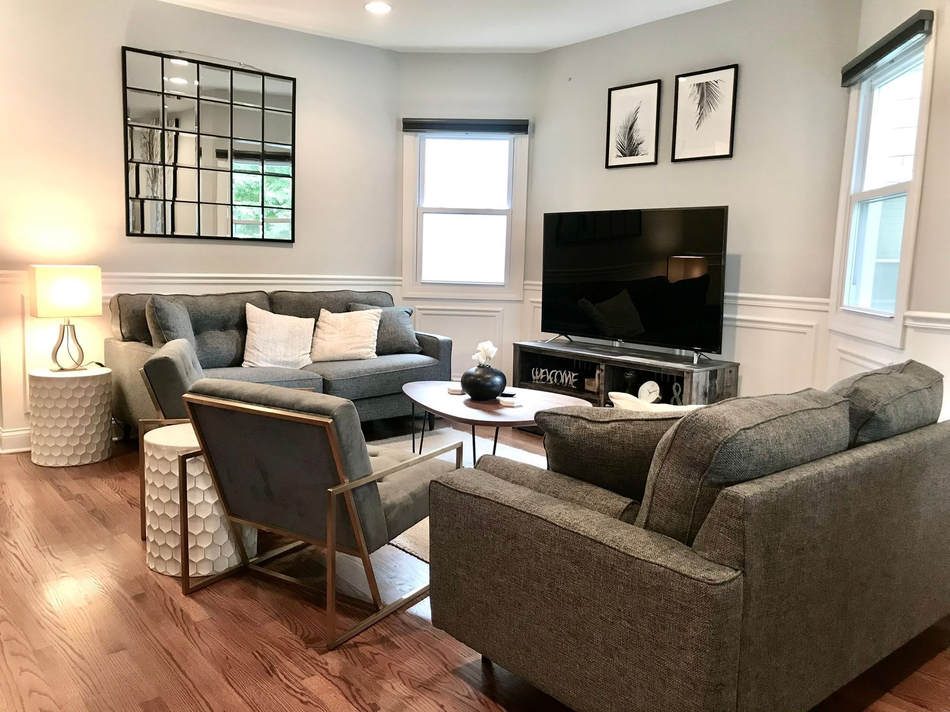A living room filled with furniture and a flat screen tv.