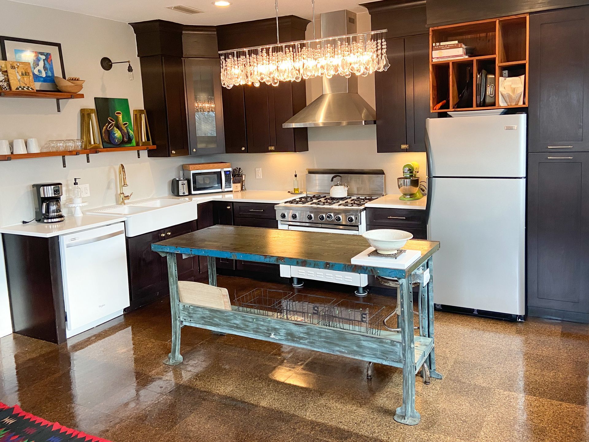 A kitchen with a large island in the middle