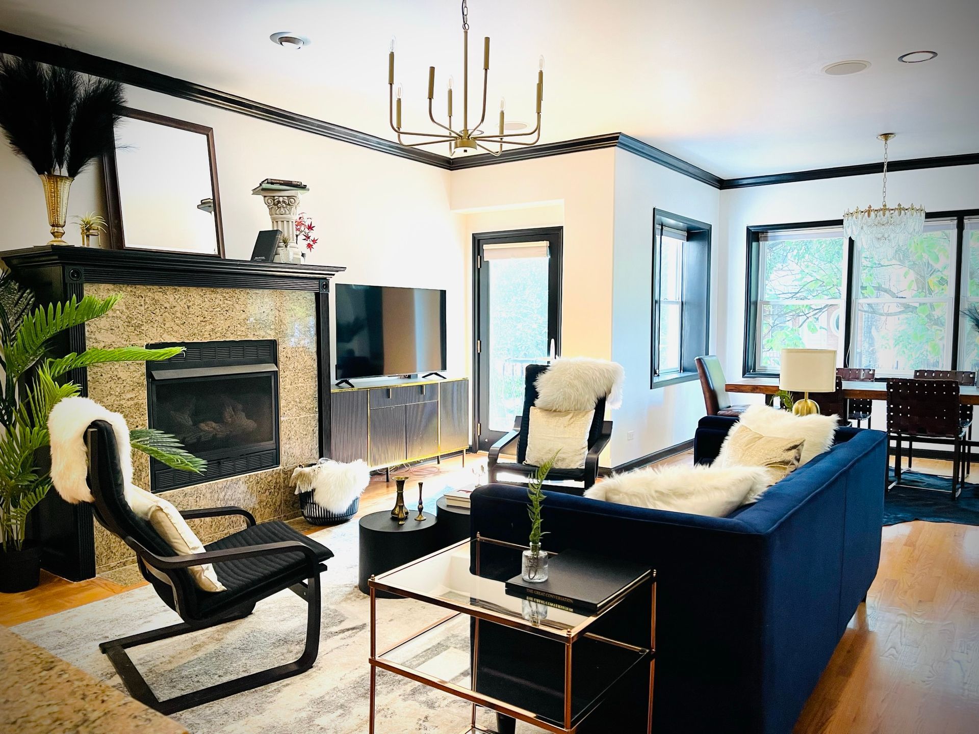 A living room filled with furniture and a fireplace.