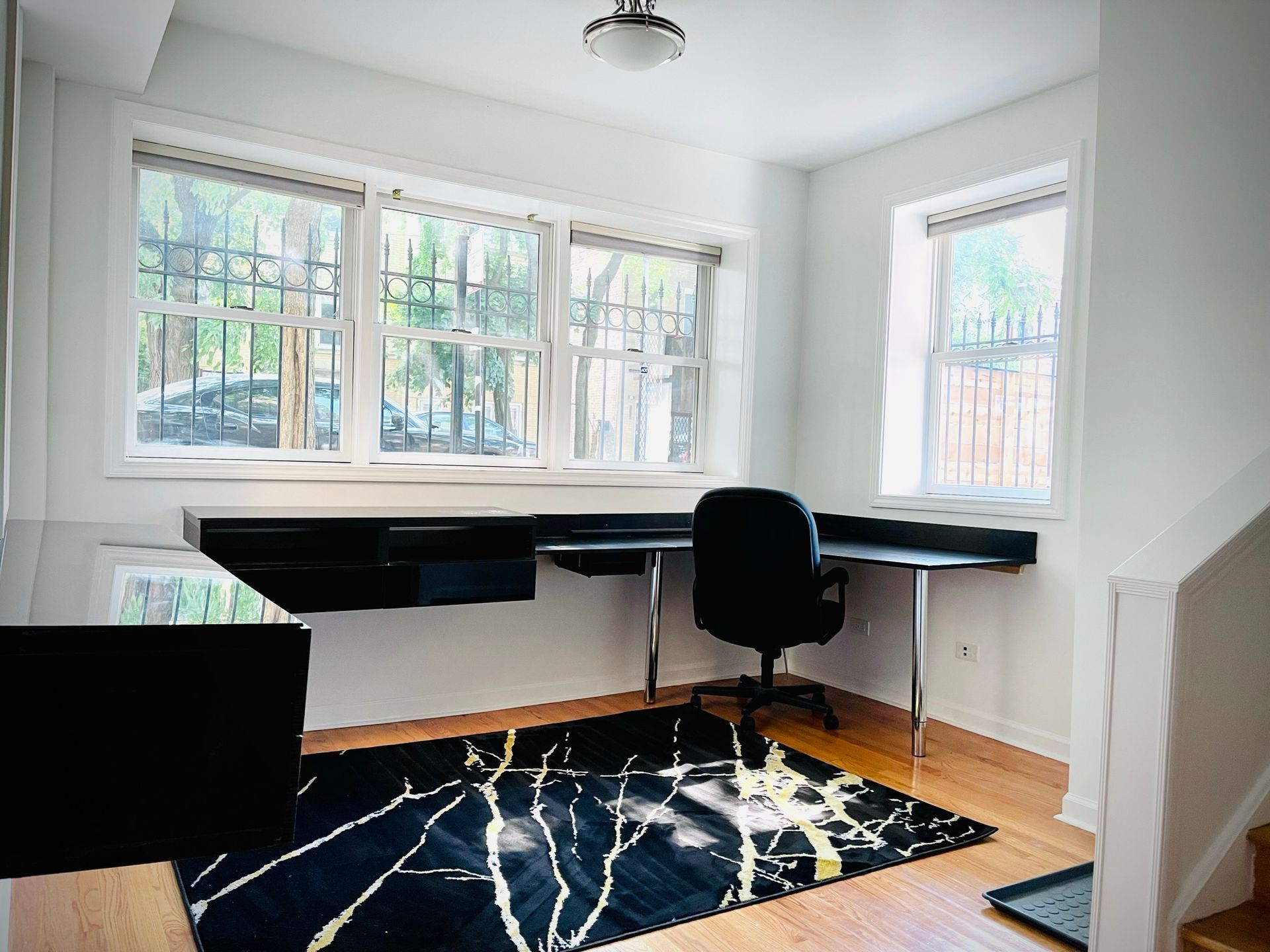 A room with a desk and a chair in it
