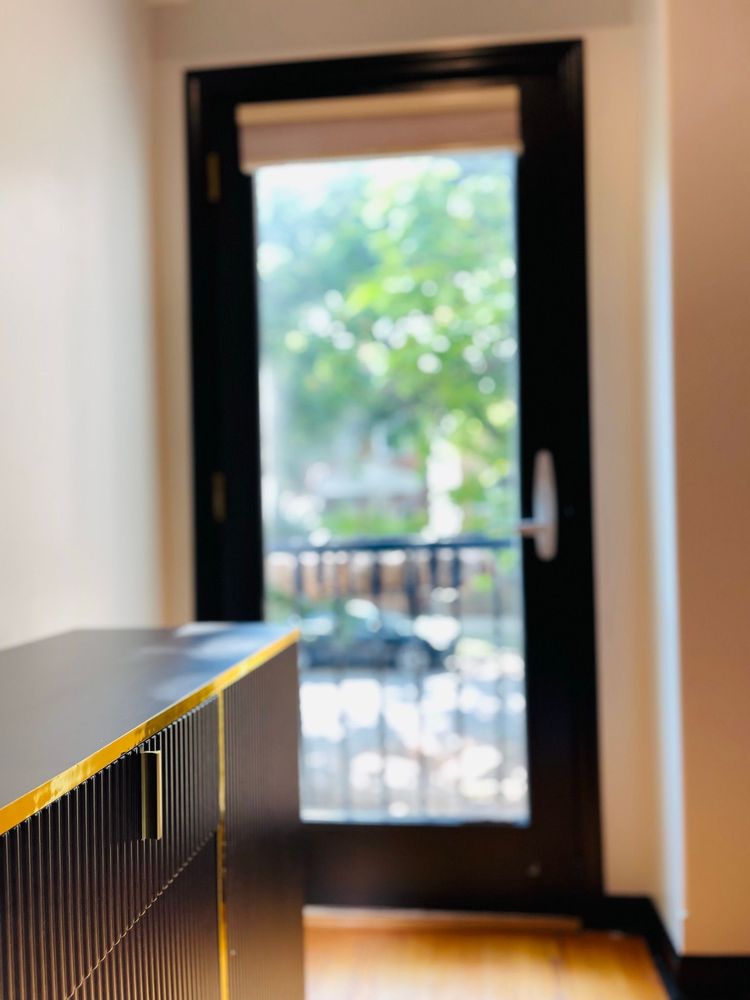 A sliding glass door is open to a balcony