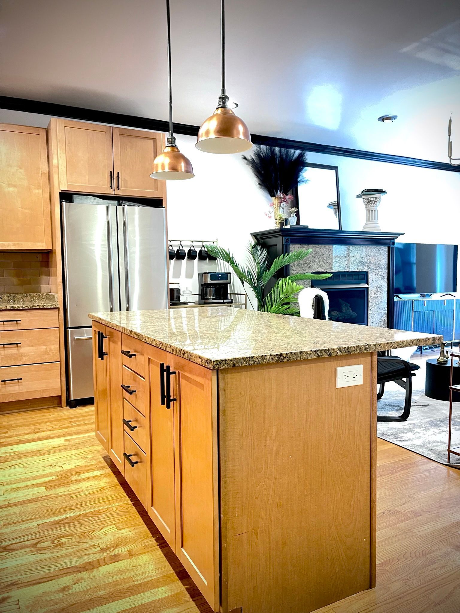 A kitchen with a large island in the middle of it