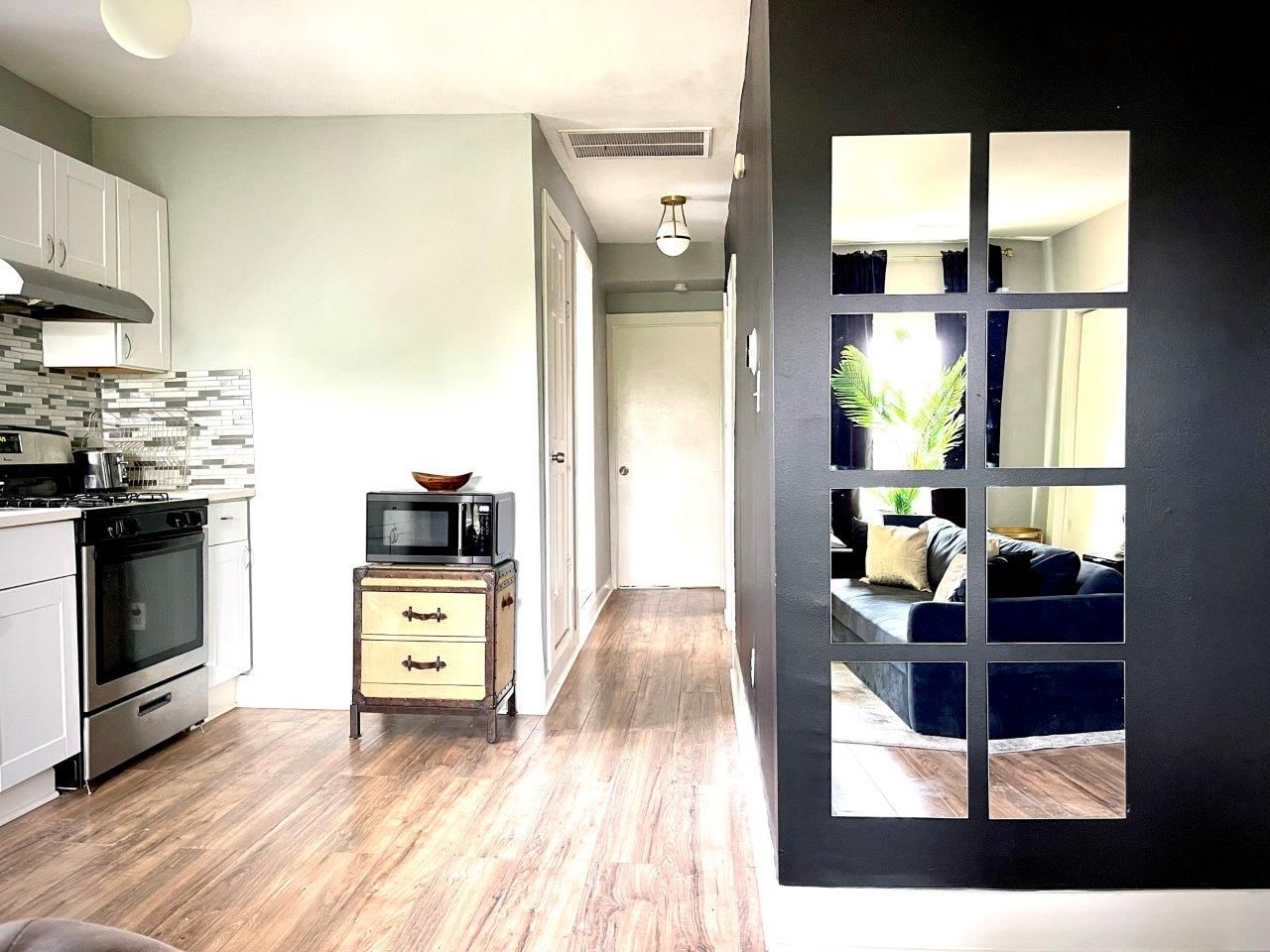 A kitchen and living room with a sliding glass door